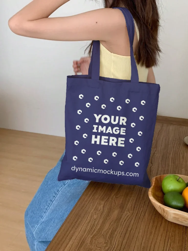 Woman Holding Navy Blue Tote Bag Mockup Side View Template