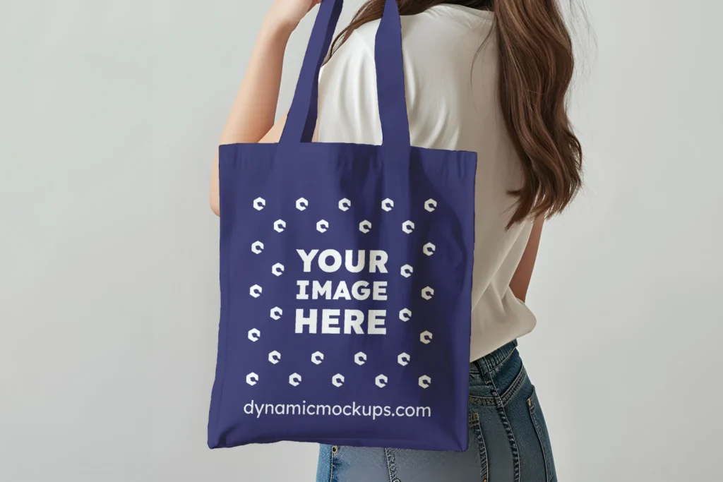 Woman Holding Navy Blue Tote Bag Mockup Side View Template