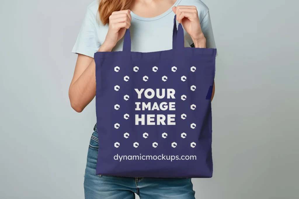 Woman Holding Navy Blue Tote Bag Mockup Front View Template