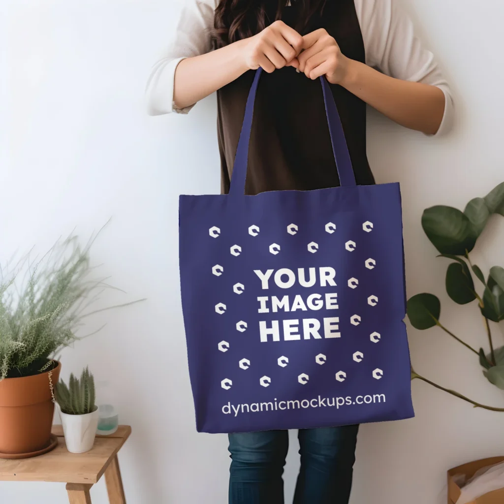 Woman Holding Navy Blue Tote Bag Mockup Front View Template