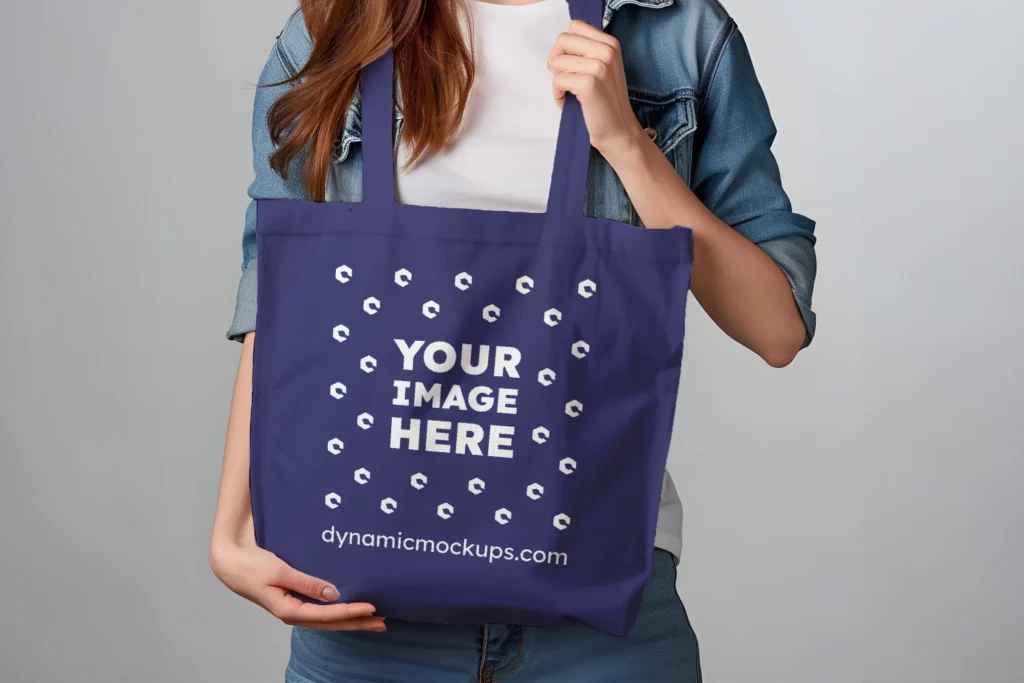 Woman Holding Navy Blue Tote Bag Mockup Front View Template