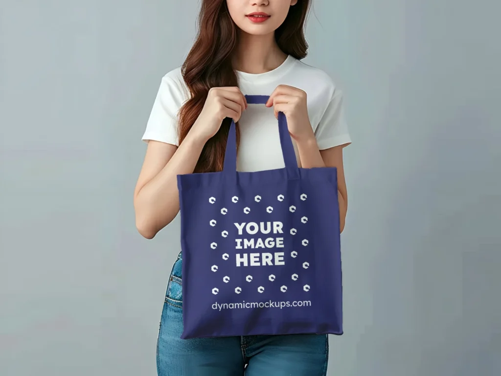 Woman Holding Navy Blue Tote Bag Mockup Front View Template