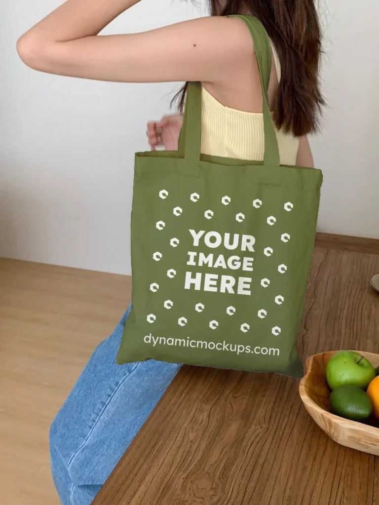 Woman Holding Olive Green Tote Bag Mockup Side View Template