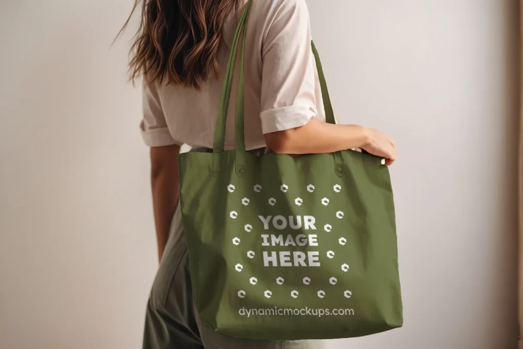 Woman Holding Olive Green Tote Bag Mockup Side View Template