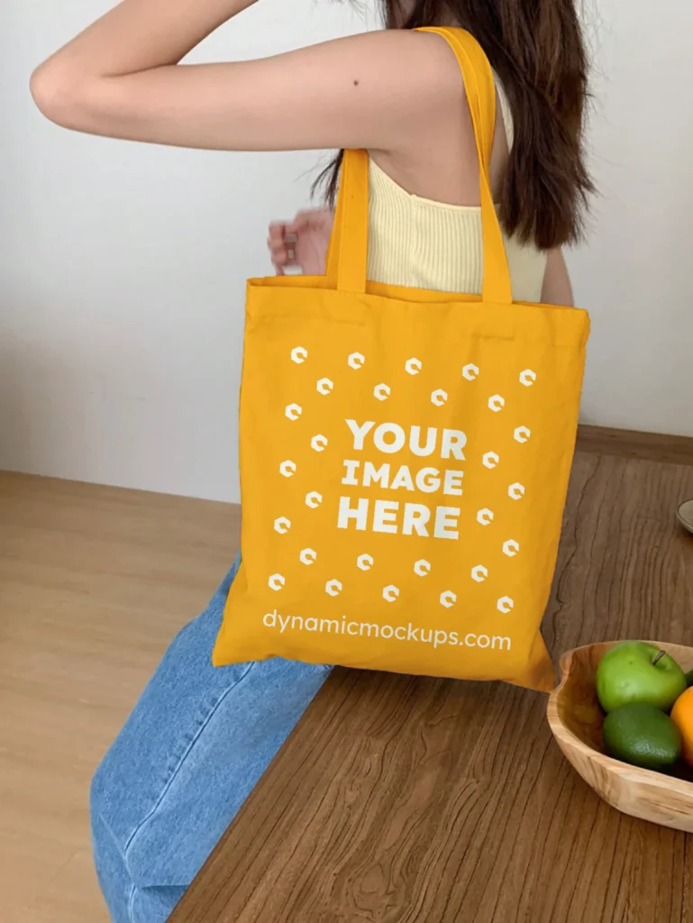 Woman Holding Orange Tote Bag Mockup Side View Template