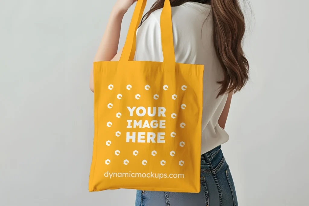 Woman Holding Orange Tote Bag Mockup Side View Template