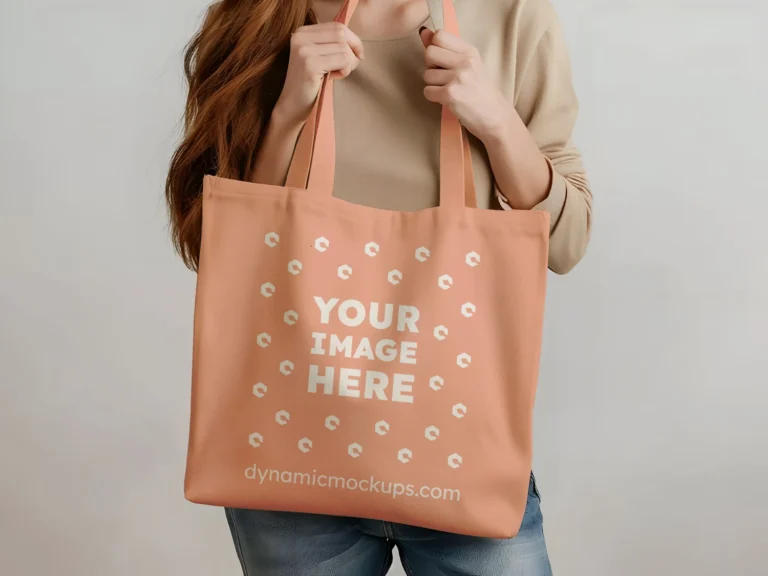 Woman Holding Peach Tote Bag Mockup Front View Template