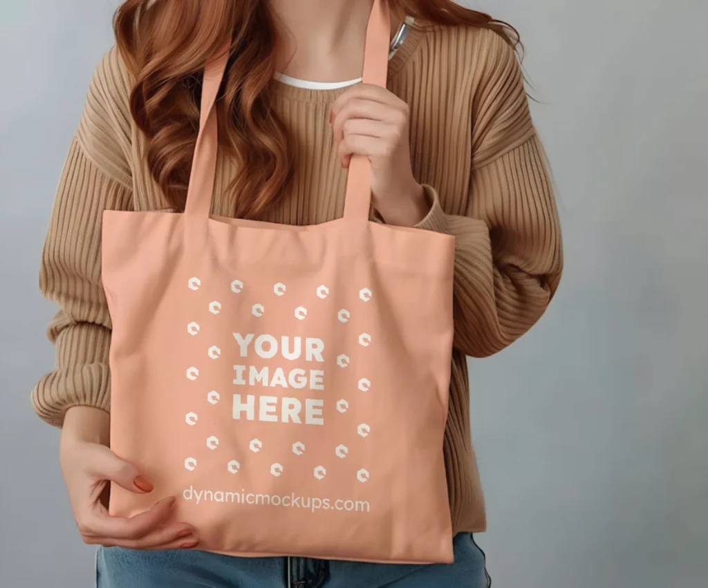 Woman Holding Peach Tote Bag Mockup Front View Template