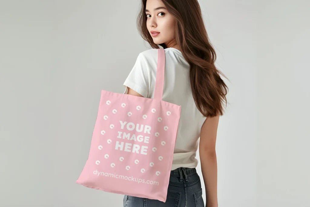 Woman Holding Pink Tote Bag Mockup Back View Template