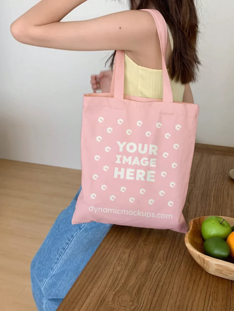 Woman Holding Pink Tote Bag Mockup Side View Template