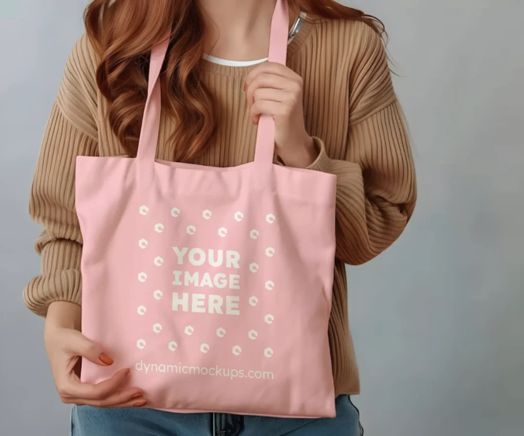 Woman Holding Pink Tote Bag Mockup Front View Template