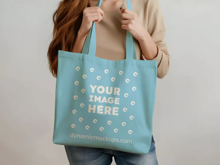 Woman Holding Sky Blue Tote Bag Mockup Front View Template