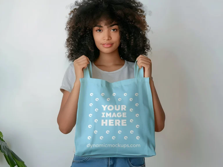 Woman Holding Sky Blue Tote Bag Mockup Front View Template