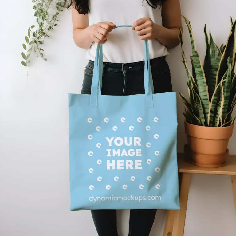 Woman Holding Sky Blue Tote Bag Mockup Front View Template