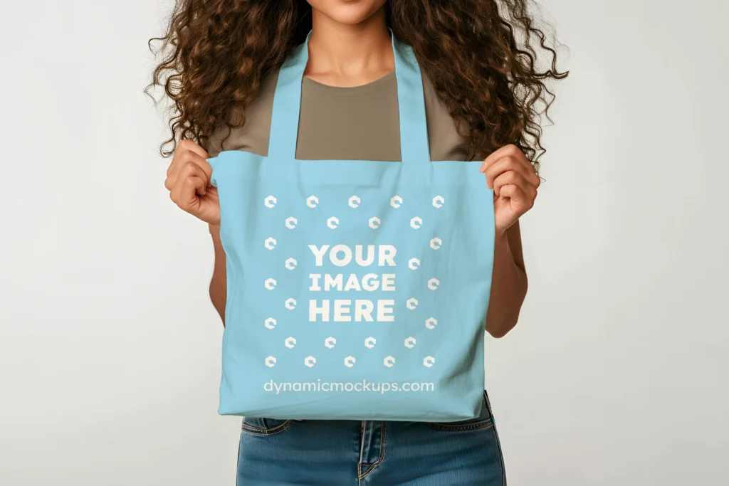 Woman Holding Sky Blue Tote Bag Mockup Front View Template