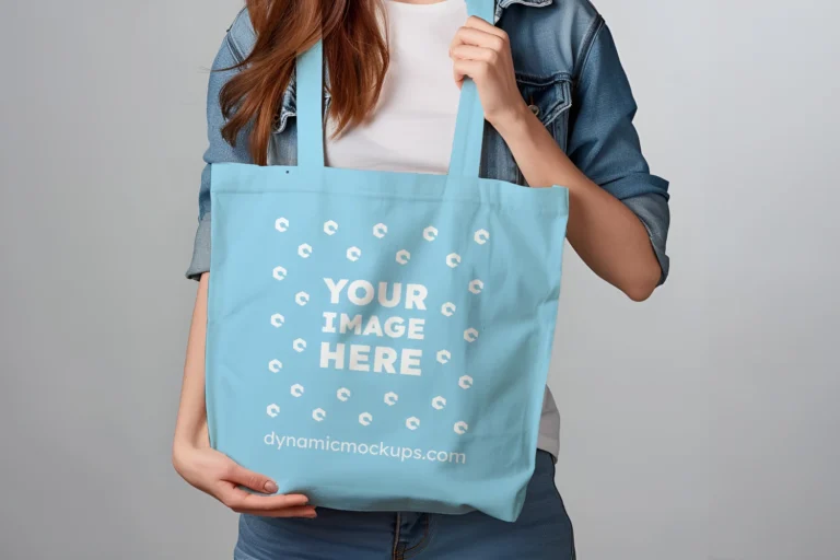 Woman Holding Sky Blue Tote Bag Mockup Front View Template