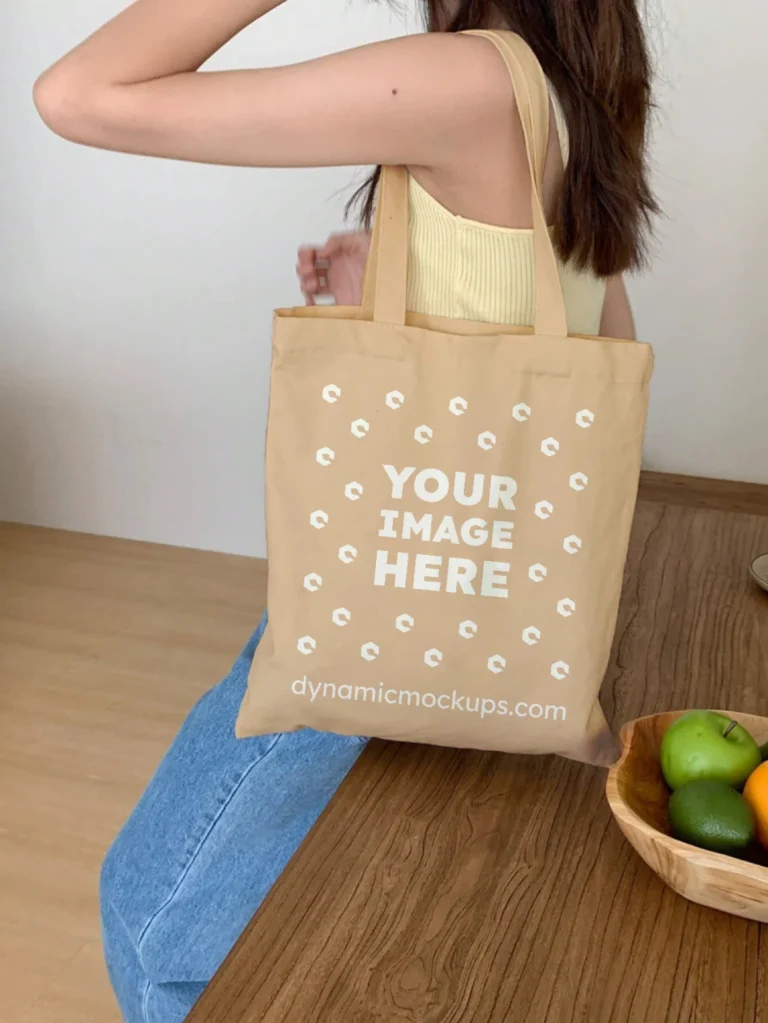 Woman Holding Tan Tote Bag Mockup Side View Template