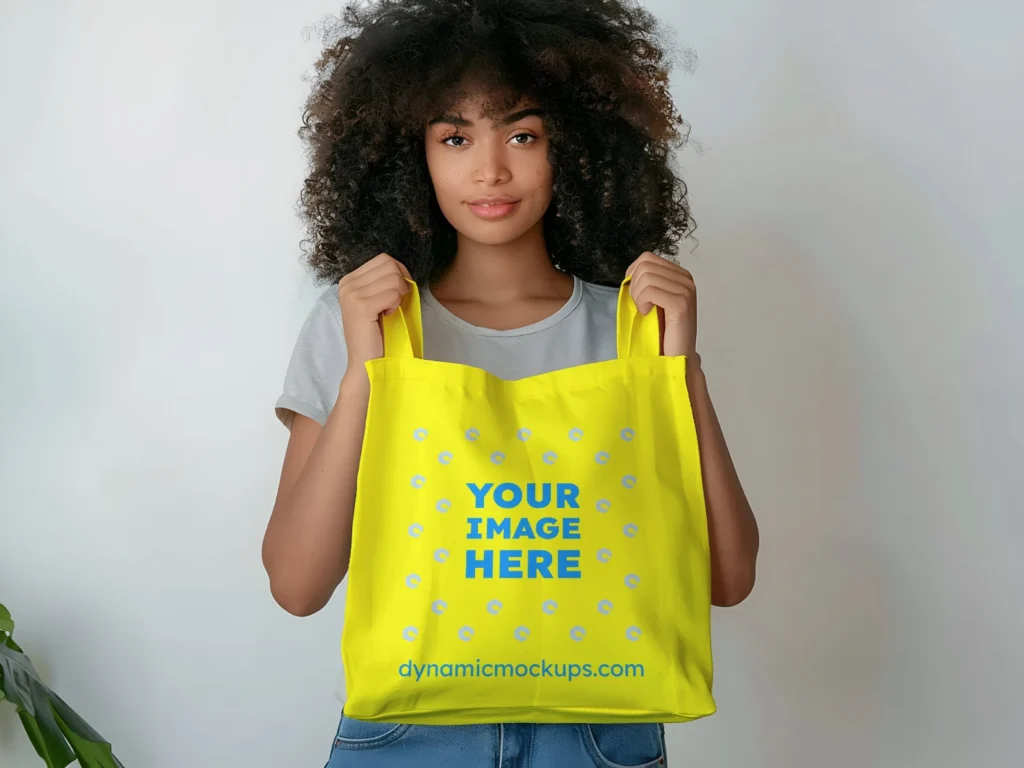 Woman Holding Yellow Tote Bag Mockup Front View Template