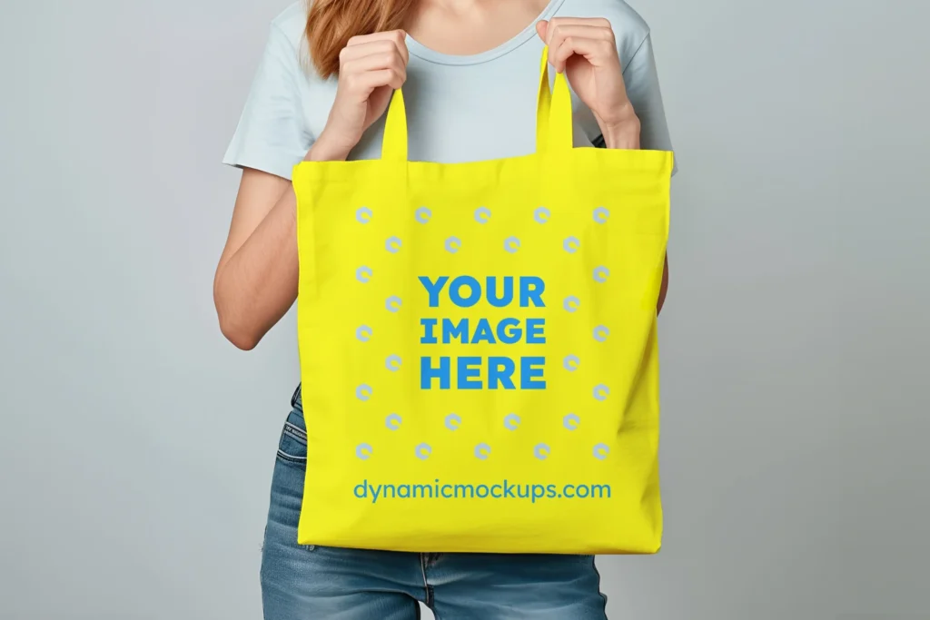 Woman Holding Yellow Tote Bag Mockup Front View Template