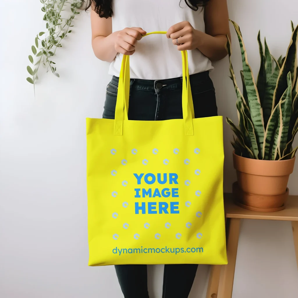 Woman Holding Yellow Tote Bag Mockup Front View Template