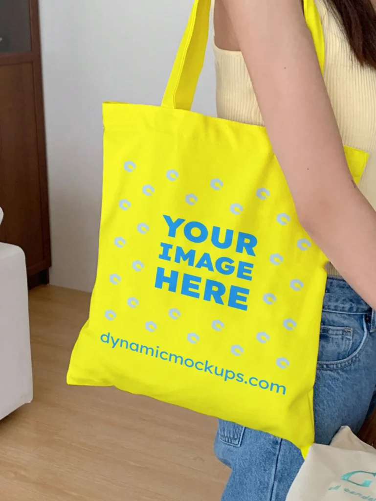 Woman Holding Yellow Tote Bag Mockup Side View Template