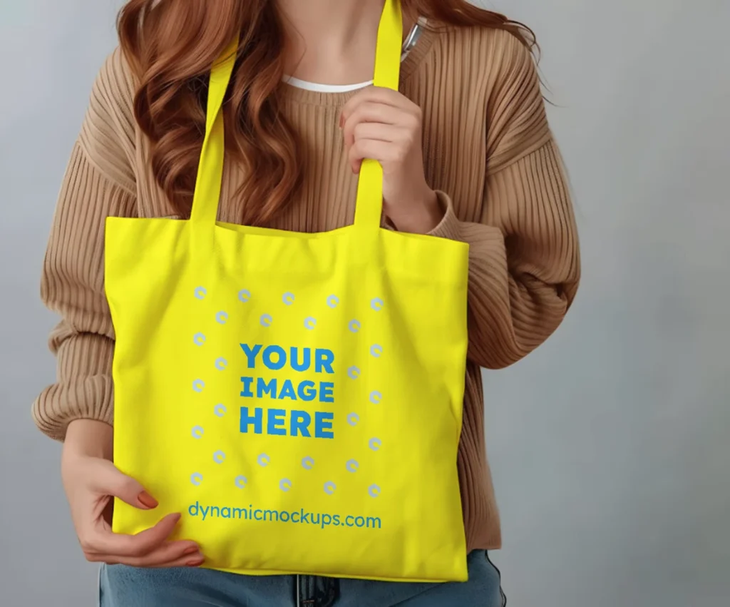 Woman Holding Yellow Tote Bag Mockup Front View Template