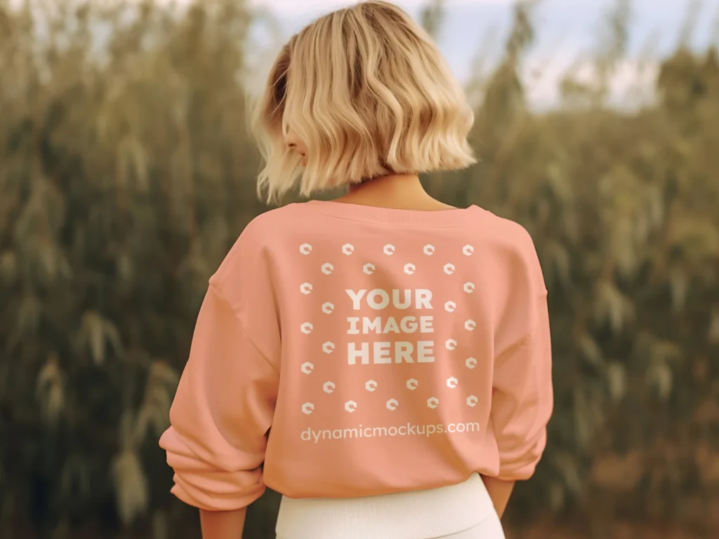 Woman Wearing Peach Sweatshirt Mockup Back View Template