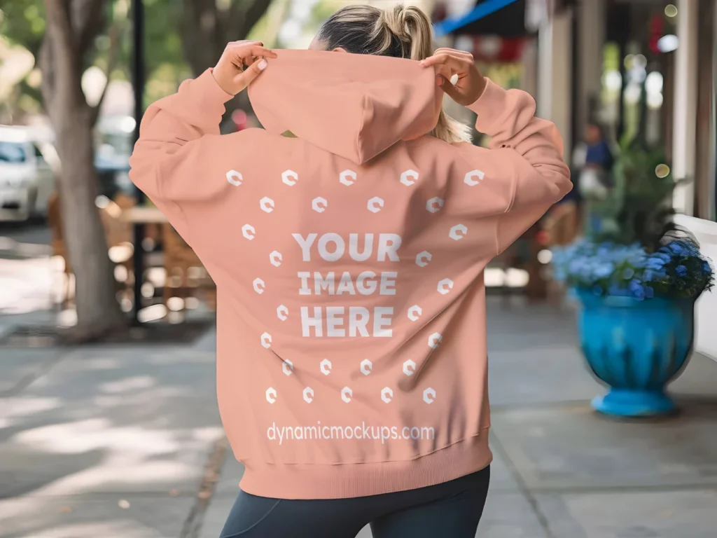 Woman Wearing Peach Hoodie Mockup Back View Template