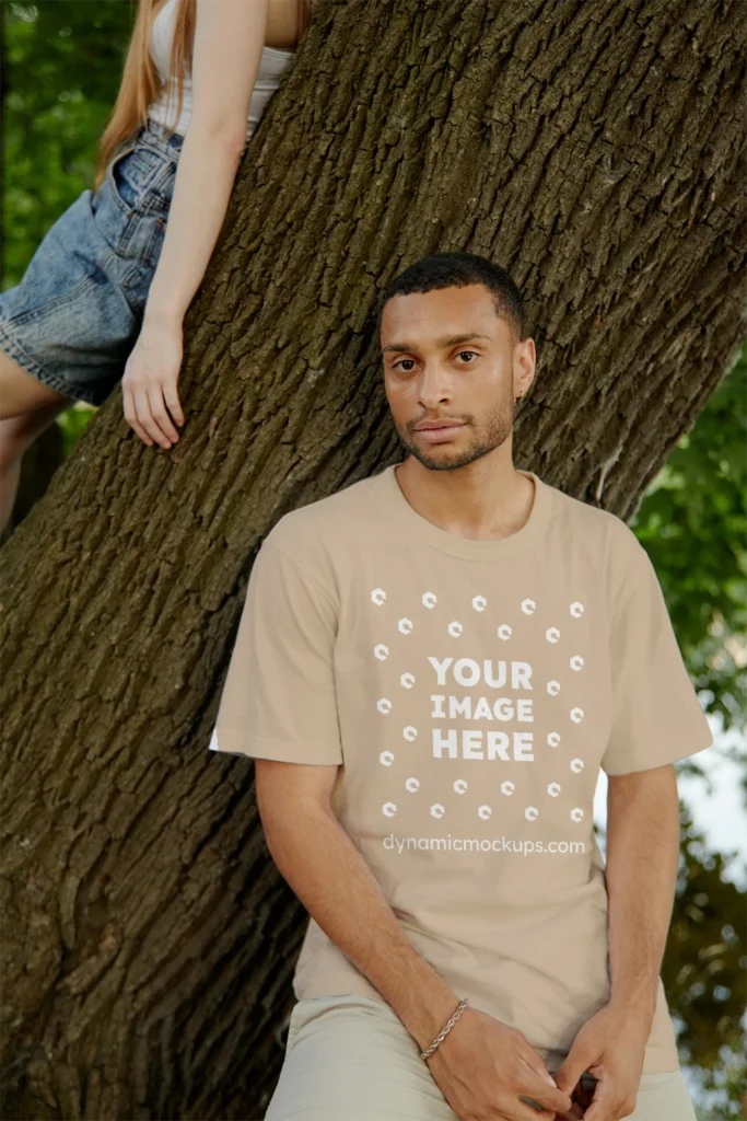 Man Wearing Beige T-shirt Mockup Front View Template