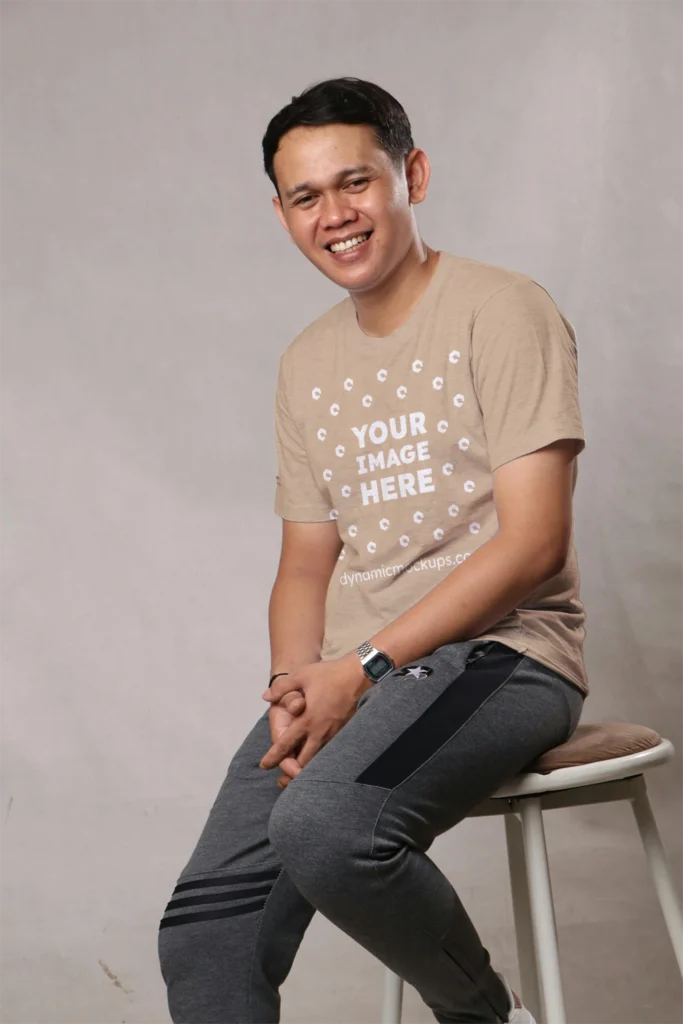 Man Wearing Beige T-shirt Mockup Front View Template