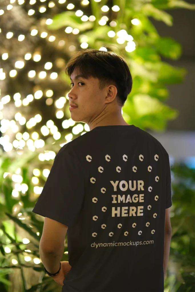 Man Wearing Black T-shirt Mockup Back View Template