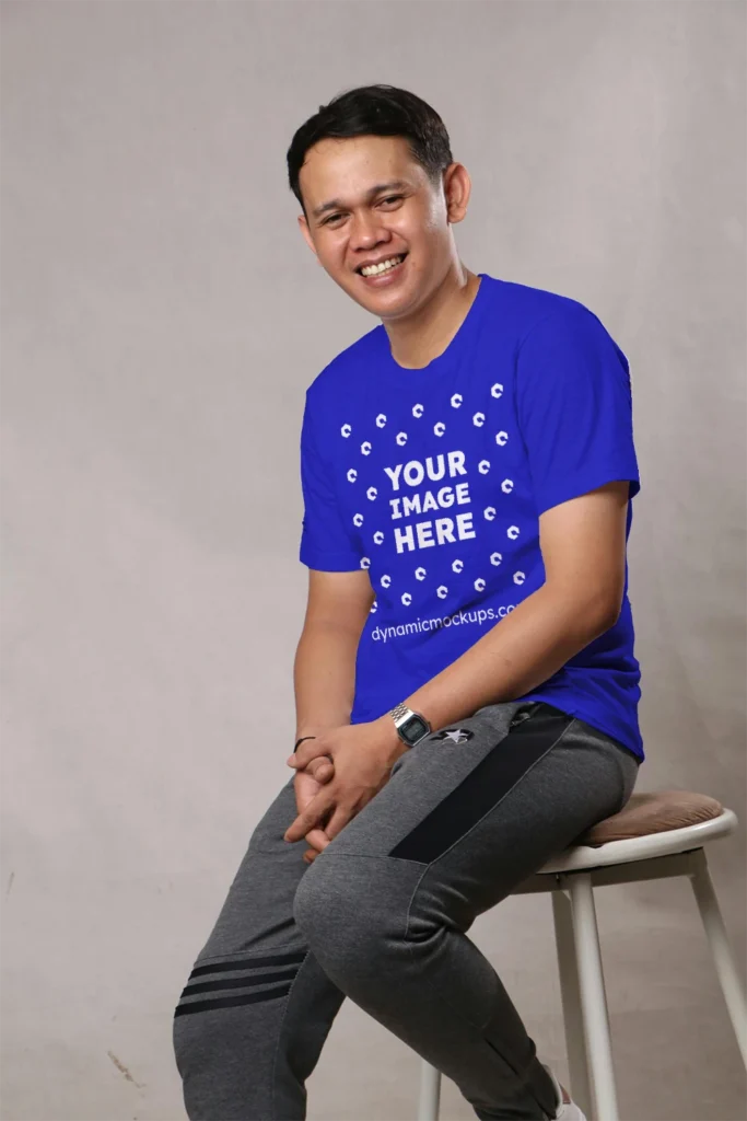 Man Wearing Blue T-shirt Mockup Front View Template