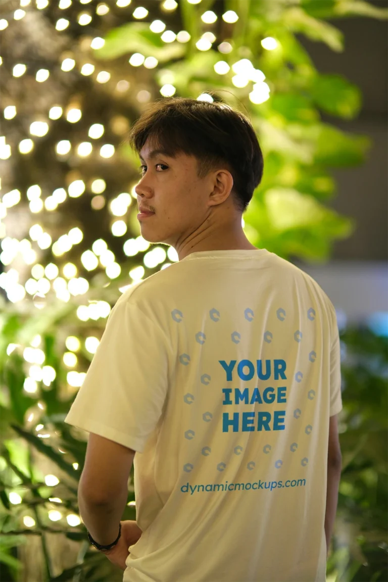 Man Wearing Cream T-shirt Mockup Back View Template