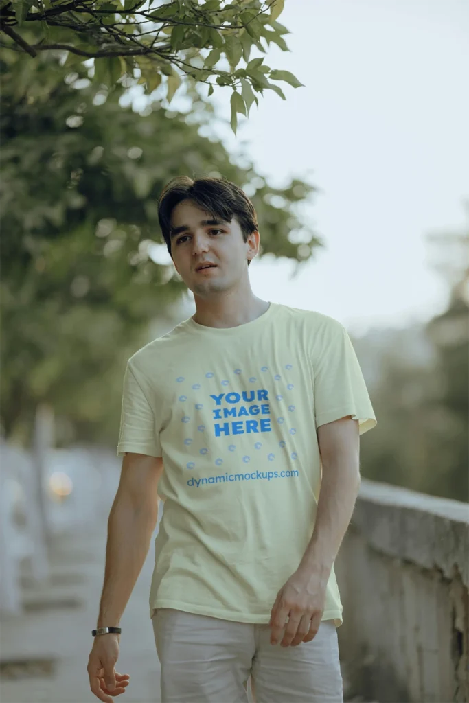 Man Wearing Cream T-shirt Mockup Front View Template