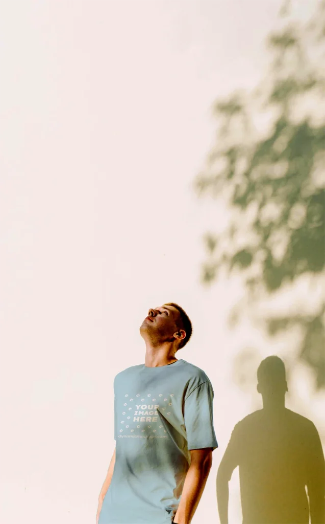 Man Wearing Light Blue T-shirt Mockup Front View Template