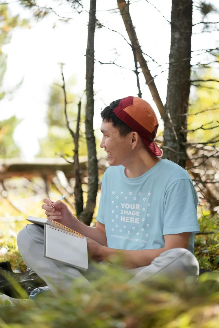 Man Wearing Light Blue T-shirt Mockup Front View Template