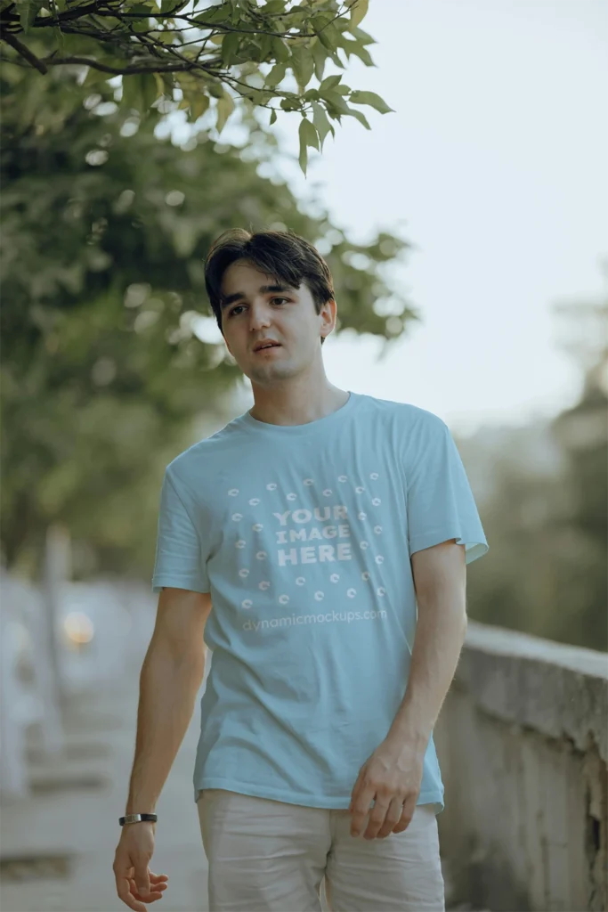 Man Wearing Light Blue T-shirt Mockup Front View Template