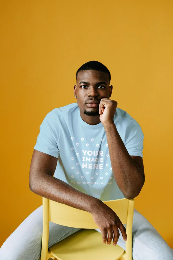 Man Wearing Light Blue T-shirt Mockup Front View Template