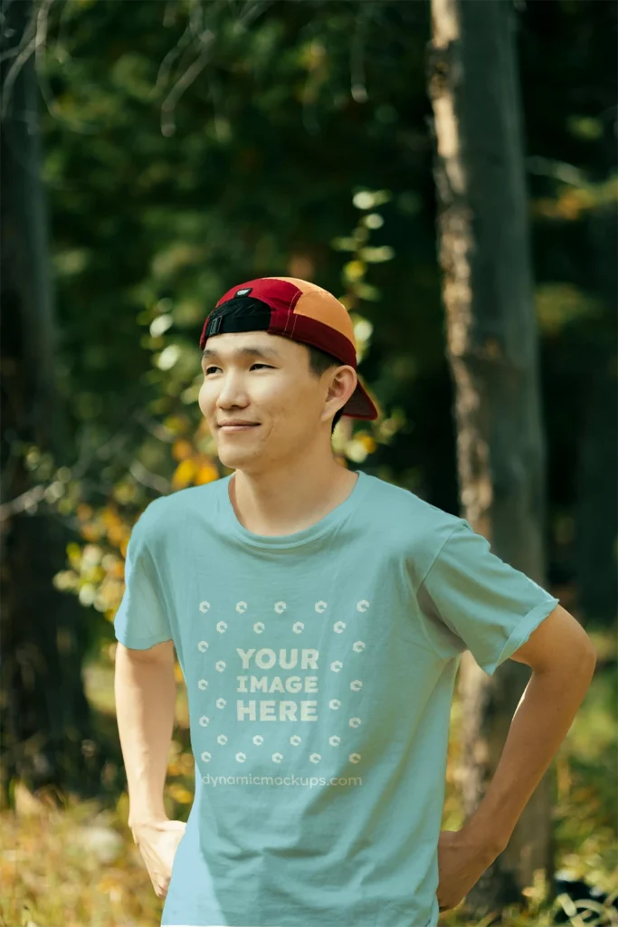 Man Wearing Light Blue T-shirt Mockup Front View Template