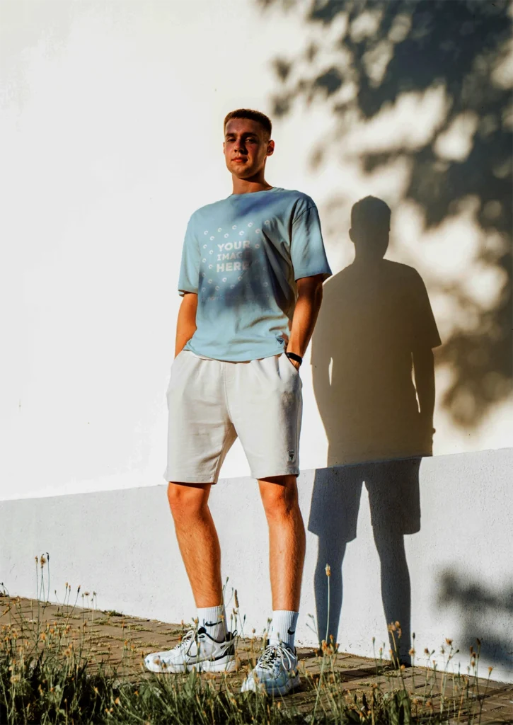 Man Wearing Light Blue T-shirt Mockup Front View Template