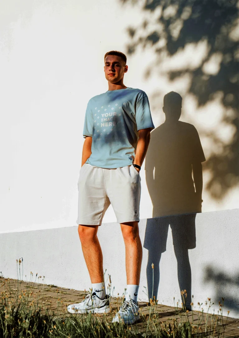 Man Wearing Light Blue T-shirt Mockup Front View Template