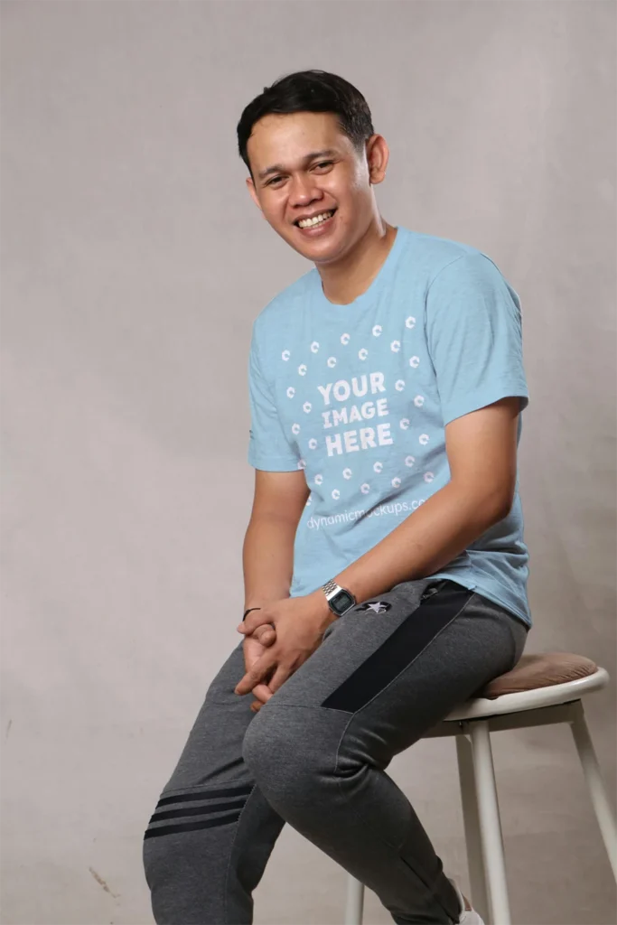 Man Wearing Light Blue T-shirt Mockup Front View Template