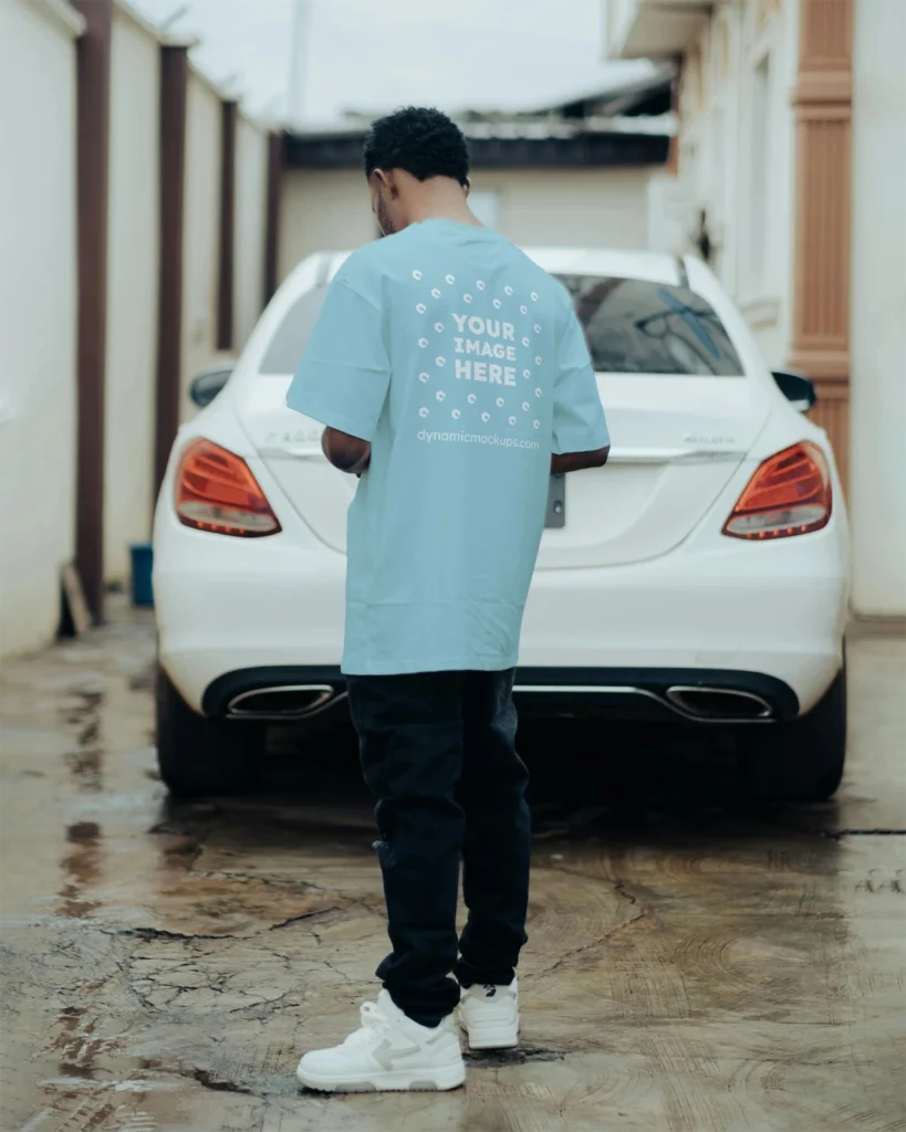 Man Wearing Light Blue T-shirt Mockup Back View Template