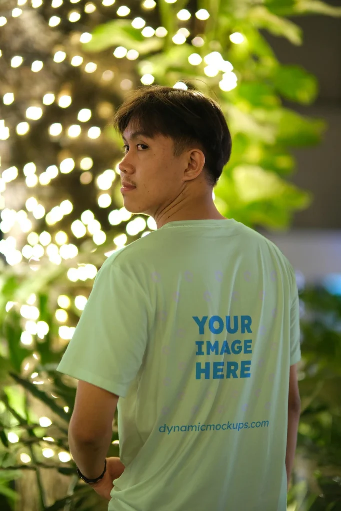 Man Wearing Mint T-shirt Mockup Back View Template