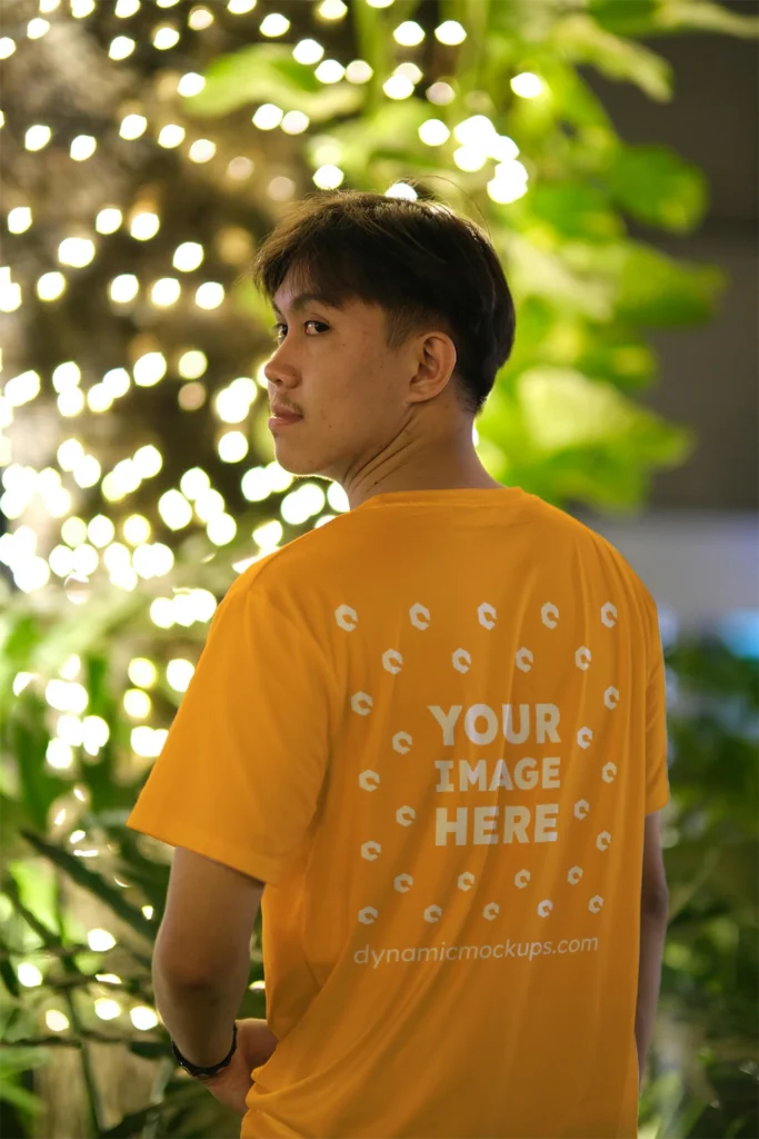 Man Wearing Orange T-shirt Mockup Back View Template