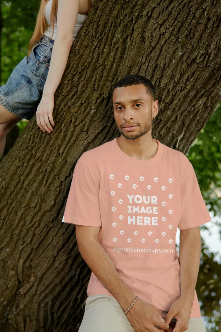 Man Wearing Peach T-shirt Mockup Front View Template