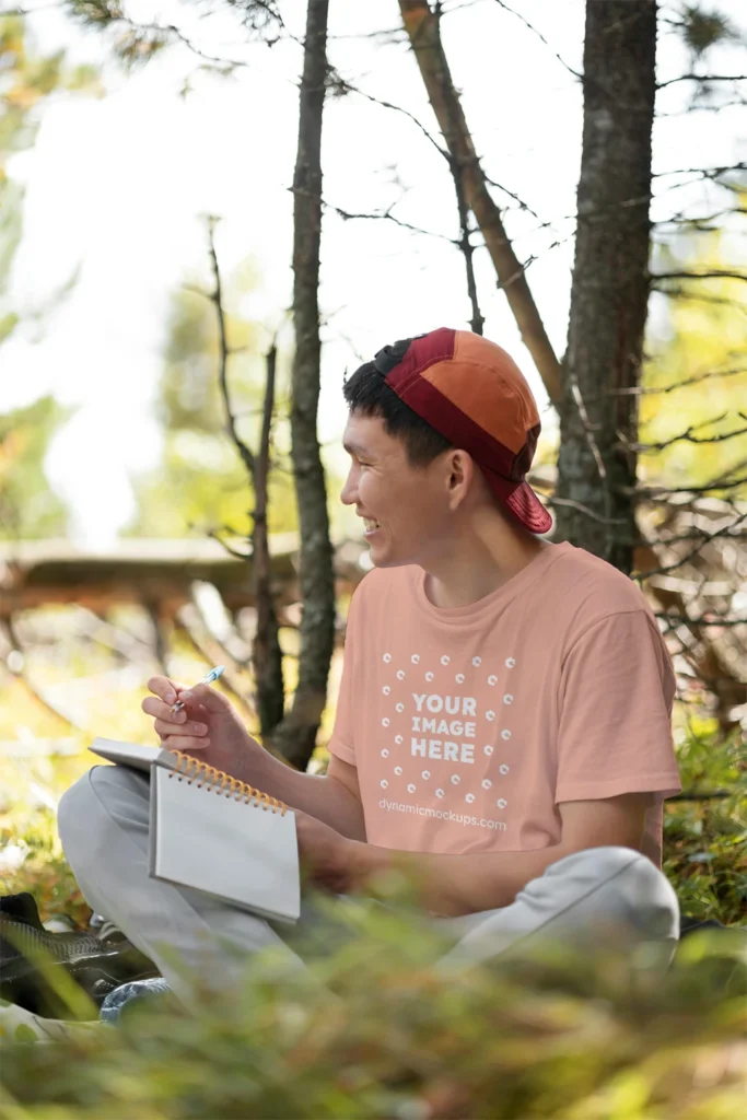 Man Wearing Peach T-shirt Mockup Front View Template