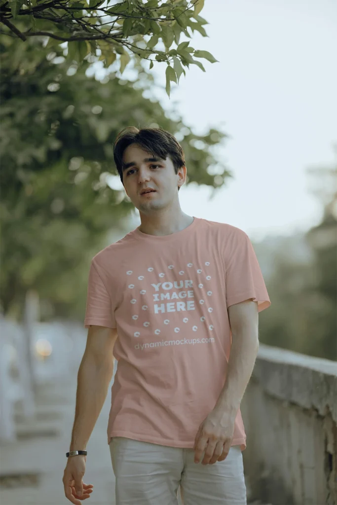 Man Wearing Peach T-shirt Mockup Front View Template