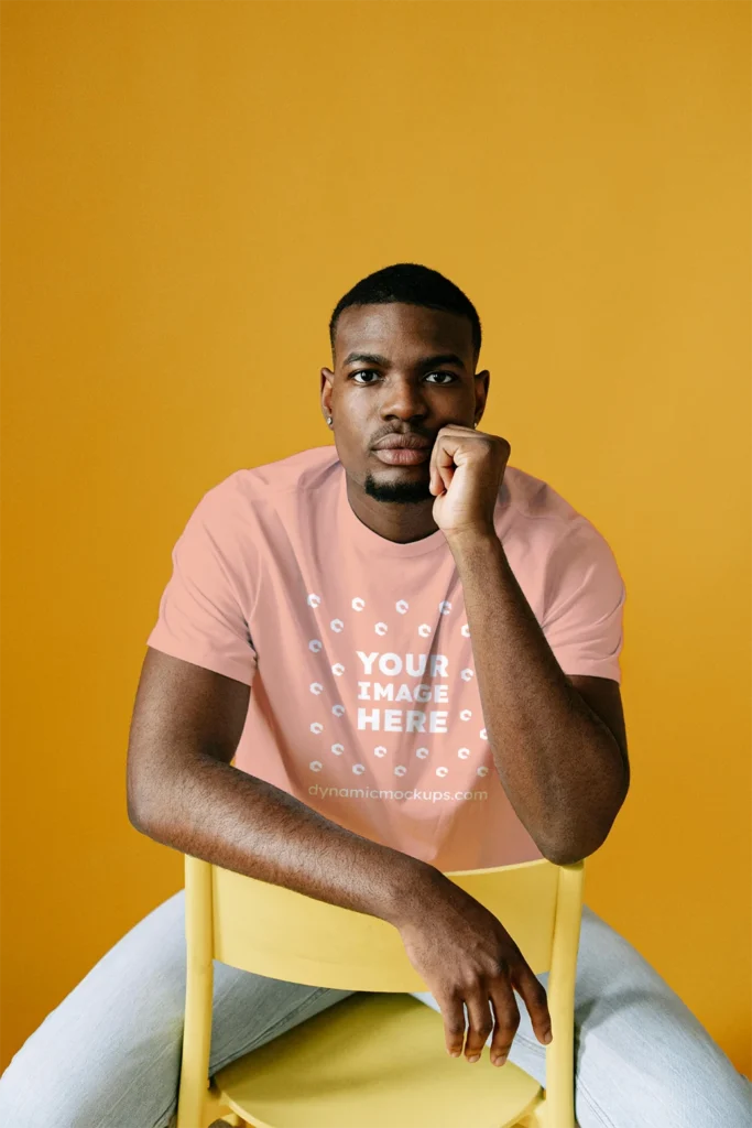 Man Wearing Peach T-shirt Mockup Front View Template