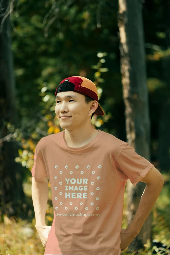 Man Wearing Peach T-shirt Mockup Front View Template